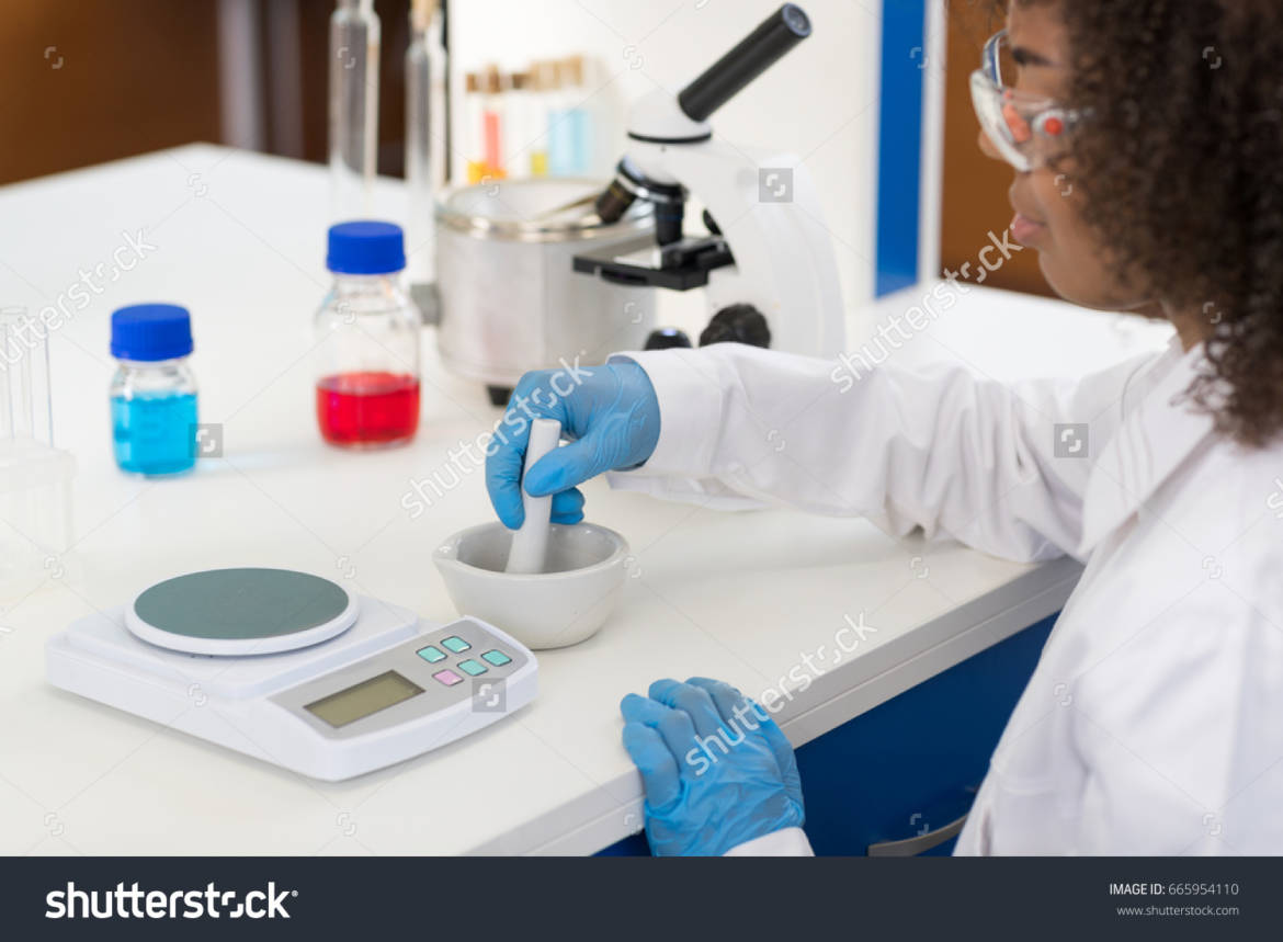 stock-photo-female-scientist-using-mortar-working-in-laboratory-making-chemicals-powder-for-experiment-665954110.jpg