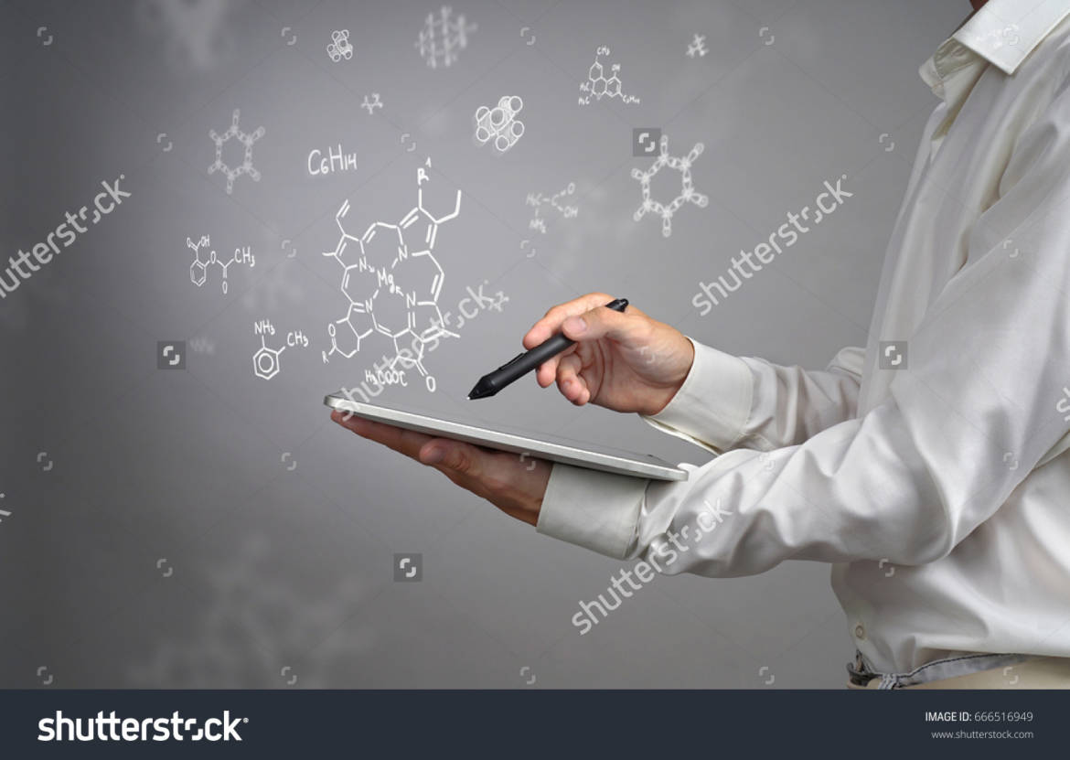 stock-photo-man-scientist-with-tablet-pc-and-stylus-or-pen-working-with-chemical-formulas-on-gray-background-666516949.jpg