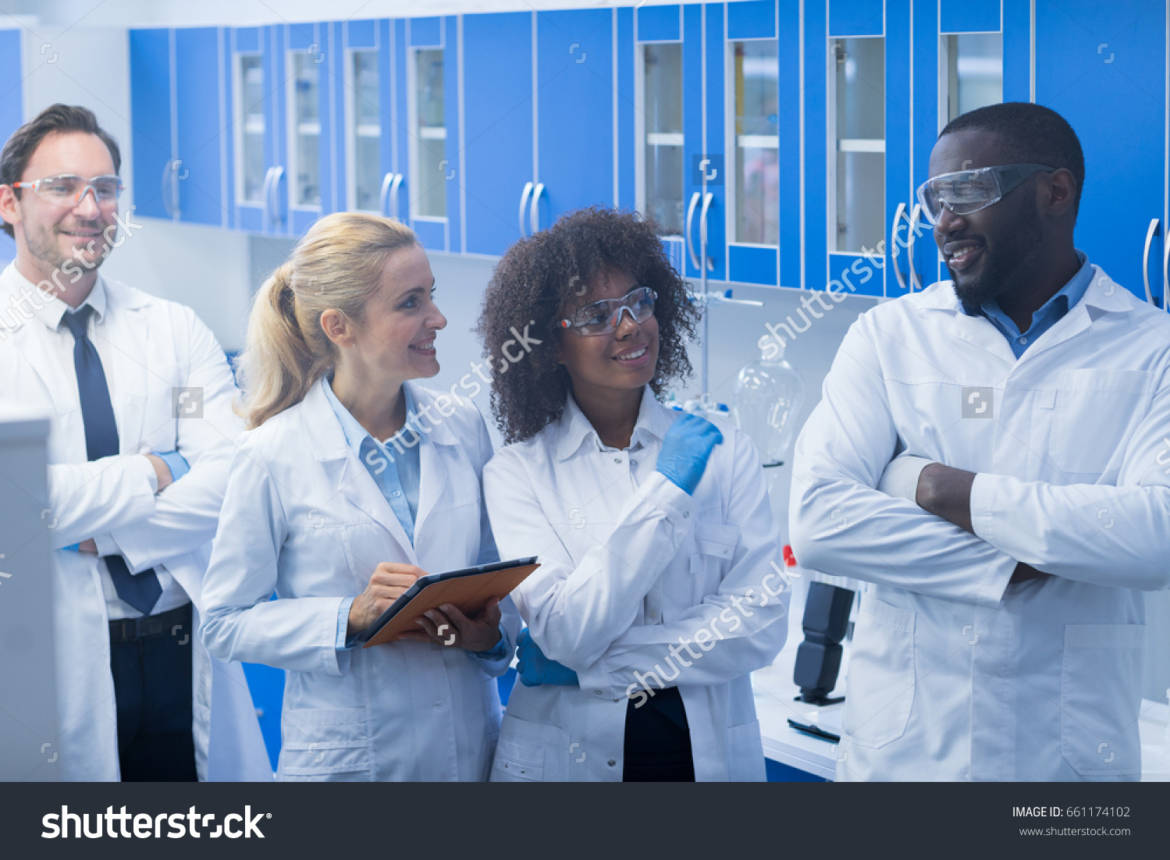 stock-photo-mix-race-scientists-team-working-in-laboratory-doing-research-man-and-woman-making-scientific-661174102.jpg